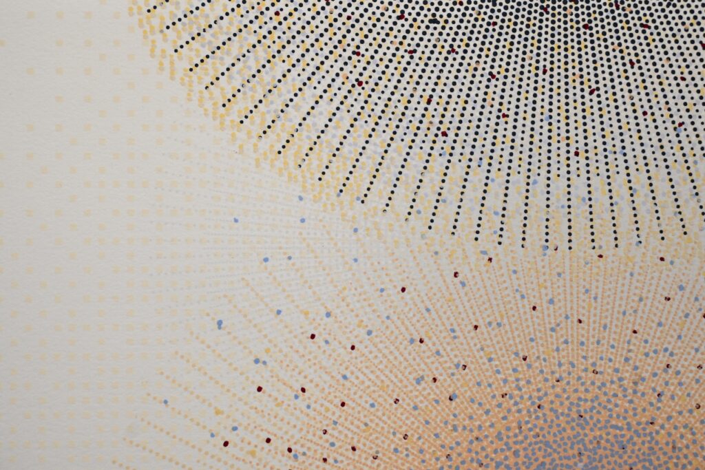 Abstract patterning of yellow and blue dots creating overlapping circles on a white background.
