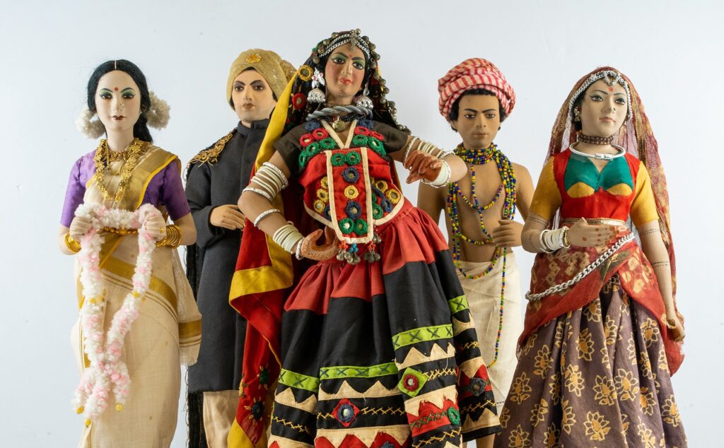 A photograph of five Indian figurines against a soft white background.