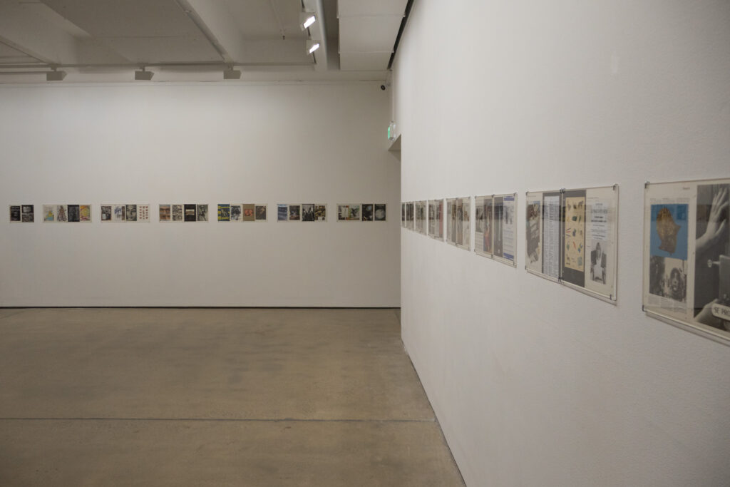 a line of collages made from magazine cut-outs are arranged linearly at eyeline around the gallery perimeter.